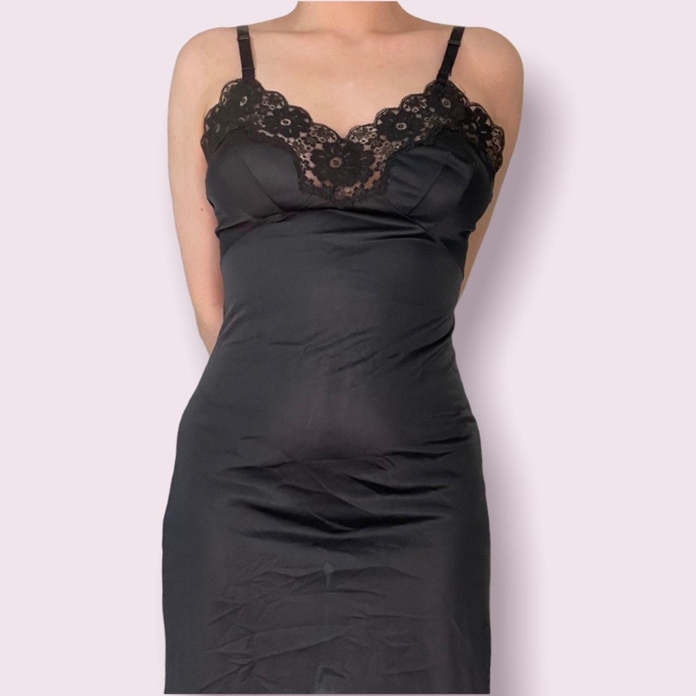 Silky black mini dress with flower pattern lace at the top of the dress